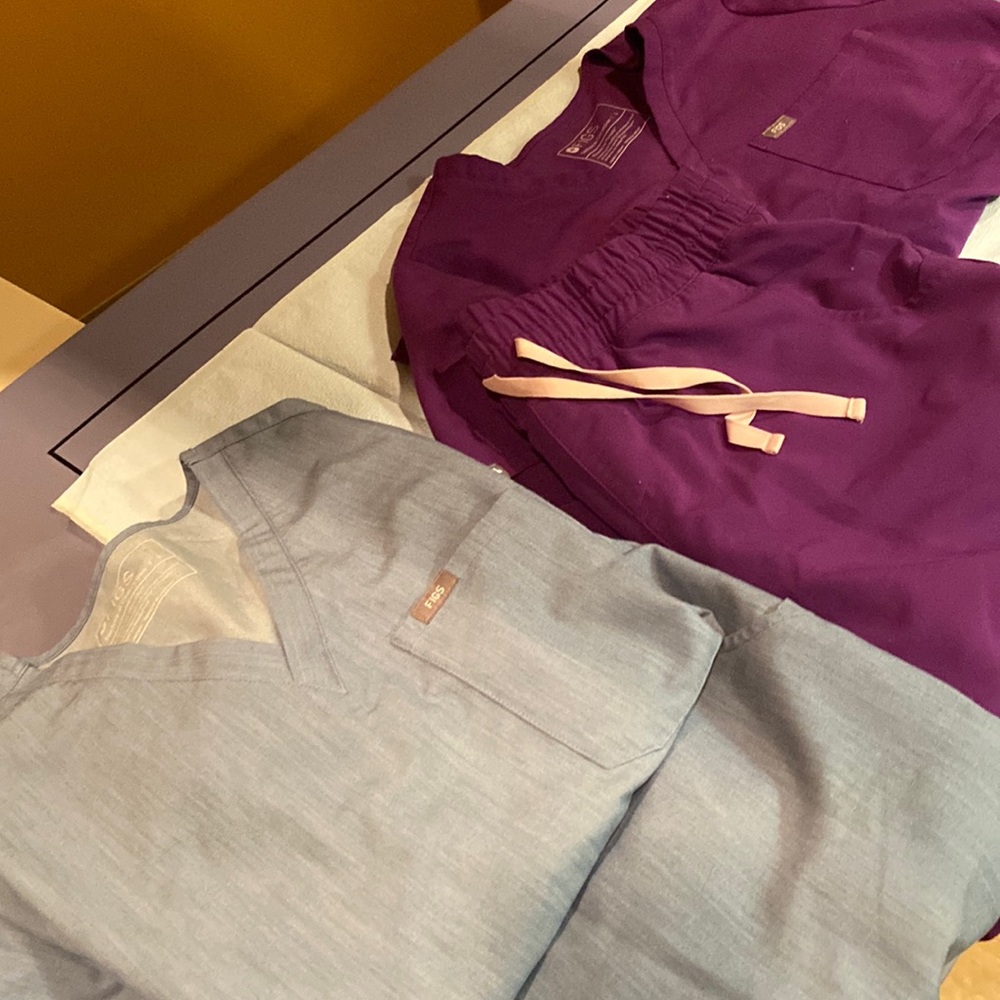 Bundle of scrubs top is large Pants or extra large petite. Blue and purple